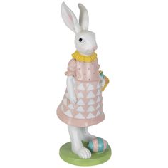 a figurine of a white rabbit wearing a pink dress