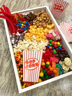 a box filled with lots of candy and popcorn