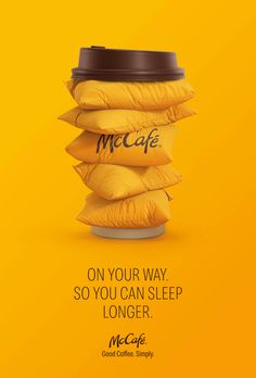 an advertisement for mcdonald's coffee with a stack of pillows on the side and a cup in the middle