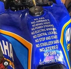 a close up of a blue motorcycle with an advertisement on the front and back end