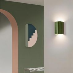 This minimalist ribbed wall sconce embodies sophistication and modernity. Its ribbed resin design adds a tactile dimension to any space, casting a soft, ambient glow that dances playfully across the walls. With a palette boasting verdant greens, fiery oranges, sleek greys, pristine whites and black, this macaron wall lamp exudes a harmonious blend of vibrancy and subtlety. Ideal for those seeking a touch of contemporary elegance in their living spaces, this modern wall lamp elevates minimalist interiors, creating a captivating focal point that transcends the ordinary. Fluted Wall, Interior Minimalista, Chandelier Table Lamp, Modern Wall Lamp, Resin Design, Pendant Lights & Chandeliers, Lamps Ceiling, Minimalist Interior, Modern Lighting