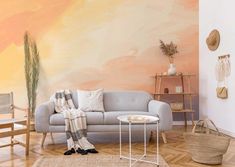 a living room filled with furniture and walls painted in pastel colors on the wall