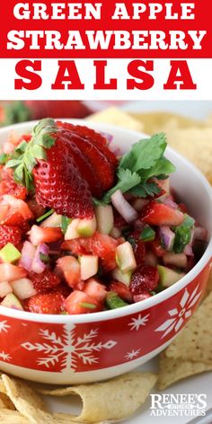 green apple strawberry salsa in a red bowl with tortilla chips on the side