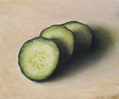 three cucumbers are shown on a white surface