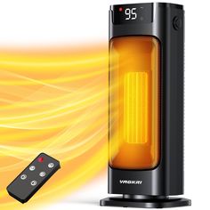 an electric heater sitting next to a remote control