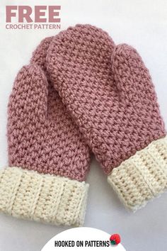 two knitted mittens sitting next to each other