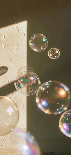 soap bubbles floating in the air next to a sink