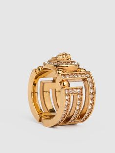 Gold-colored metal. Crystal detail. Logo detail. Nickel free Versace Gold, Ski Accessories, Ring Watch, Crystal Ring, Gold Crystal, Flat Espadrilles, Heeled Loafers, Crystal Rings, Charm Earrings