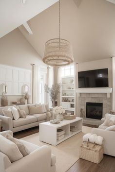 a living room filled with furniture and a flat screen tv mounted on the wall over a fireplace