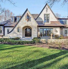 a large house with stone and brick accents