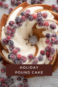 a holiday pound cake with white frosting and berries on top, surrounded by cranberries