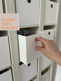 a person's hand reaching for some drawers in a storage unit with the words custom sizes available