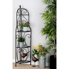 a corner shelf with potted plants on it