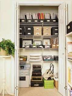 the closet is filled with many items and storage bins, including file folders