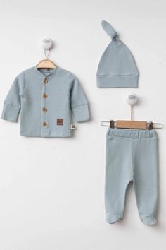 This cute and comfy baby boy outfit set from THA Dressing offers both comfort and style for your little one. With its soft fabric and lovely blue color, it's a great choice for everyday wear or special occasions. The set includes a hat, sweatshirt, and pants, keeping your baby boy warm all the time. Sweat: A buttoned jacket with long sleeves. The buttons have a wooden look and there are three buttons on the front of the jacket. Hat: A baby hat in the same color and texture with a knot at the tip Boy Outfits Aesthetic, Blue Clothes, Christmas Dress Baby, Newborn Sets, Art Calligraphy, Clothes Set, Newborn Dresses, Long Sleeve Onesie, Baby Hat