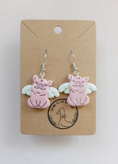 Celebrate the Flying Pig Marathon in style with these handcrafted earrings. They are lightweight, hypoallergenic, nickel-free, and so Cincinnati! ️️ Pig Polymer Clay, Flying Pig Earrings, Flying Pig Marathon, Pig Earrings, Clay Diy Projects, Flying Pig, Handcrafted Earrings, Diy Clay, Handmade Polymer Clay