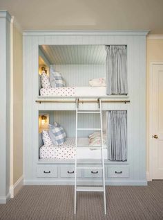 a bunk bed with two sets of drawers and a ladder to the top, in a room with beige carpeting