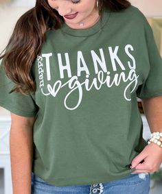 Celebrate the season of gratitude with our "Happy Thanksgiving" graphic shirt! Featuring white lettering that says "Happy Thanksgiving," this shirt is available in your choice of festive fall colors. Perfect for family gatherings, Thanksgiving dinner, or any harvest celebration, this shirt comes in sizes YXS-5XL and is available in short sleeve, long sleeve, or sweatshirt styles. Embrace the warmth of fall and show your Thanksgiving spirit in style! Season Of Gratitude, School Ties, Harvest Celebration, Vinyl Quotes, Monogram Shirts, Black Friday Christmas, Feeling Hot, Rain Gear, Thanksgiving Shirts