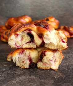 several pastries stacked on top of each other with cranberry fillings in the middle