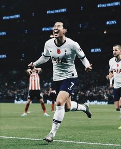 the soccer player is celebrating his goal on the field