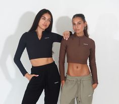 Meet Frequency's CLS Ribbed Top. This cropped long sleeve top is flattering, fun, and functional. Perfect for a chic, athleisure style or supportive sweat-sesh top. You can't go wrong with this Frequency new arrival. Pair the CLS Ribbed Top with our naked legging or B2B Sweatpants. Choose to wear our chocolate brown color or black! FABRICATION Machine wash cold on gentle cycle, with like colors. Tumble dry low; low iron. Do not dry clean Center front quarter zipper Designed & uniquely fit to fla Trendy Long Sleeve Sports Top, Long Sleeve Tops With Thumbholes For Streetwear, High Stretch Functional Tops For Streetwear, Trendy Workout Tops With Thumbholes, Athleisure Crop Top For Fall, Fall Athleisure Crop Top, Sporty Long Sleeve Crop Top For Workout, Trendy Cropped Gym Tops, Fall Sports Crop Top