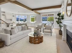 a living room filled with furniture and a fire place