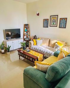 a living room filled with furniture and a flat screen tv