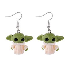 a pair of earrings with a baby yoda doll hanging from it's ear