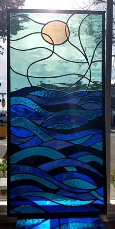 a stained glass window sitting on top of a table