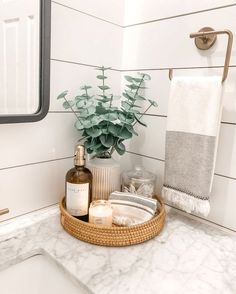 a bathroom sink with a basket on the counter