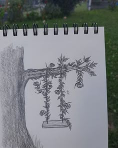 a drawing of a swing hanging from a tree with leaves and flowers attached to it