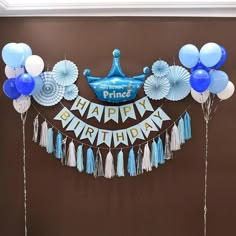 a birthday decoration with balloons and streamers