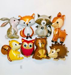 a bunch of foil balloons that are shaped like animals