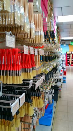 there are many different types of umbrellas on display in the store, including one for sale