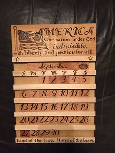 some wooden signs with writing on them and numbers in the bottom row that say, america one nation under god with liberty and justice for all