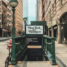 there is a sign that says new york on nowhere next to a bike parked in front of it