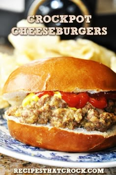 crockpot cheeseburger on a blue and white plate with chips in the background