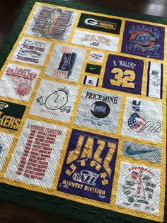 a quilt made to look like it has many different sports logos on it, including the number 22