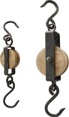 two wooden and metal hooks attached to each other