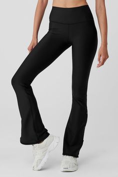 It’s our sleekest signature fabric in cut of the moment — bootcut! The Airlift High-Waist Game Changer Legging has landed, with forward flares, a high waist and snaps down the sides. Effortlessly tie your studio-to-street look together by pairing it with a cropped coverup. Smoothing, second skin feel & cool side snaps Forward bootcut fit & wide waistband Designed & uniquely fit to flatter every size Wear-tested by our in-house team for the perfect fit Boot Cut Leggings, Womens Black Pants, Alo Yoga Pants, Street Look, Flare Leggings, Alo Yoga, Wide Waistband, Yoga Wear, Yoga Women