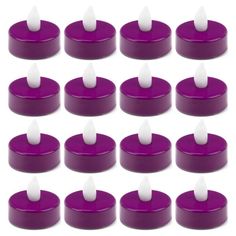 purple and white candles are arranged in rows