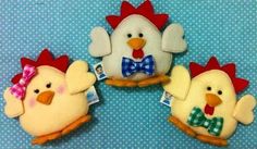 three stuffed chickens with bow ties on their heads