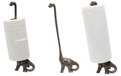 three different types of toilet paper holders with one elephant and the other giraffe