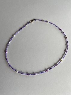 Shades of pastel purple on seed beads and glass pearls make this a perfect present for a purple lover! Necklaces are approximately 17 inches long and a 2 inch extender is included. Color differences may be due to photographic or screen differences. Please use care with handmade jewelry.  Avoid perfumes, lotions, oils, chlorine, etc for longevity. Purple Beaded Necklace, Violet Pastel, Purple Pastel, Bracelets And Rings, Seed Bead Necklace, Pastel Purple, Purple And Green, Dainty Necklace, Jewelry Inspo