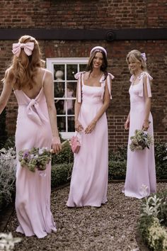 the bridesmaids are dressed in pink dresses