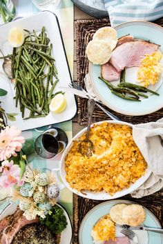 an assortment of food is laid out on the table for people to enjoy it together