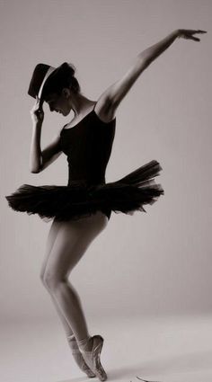 a ballerina in a tutu and top hat