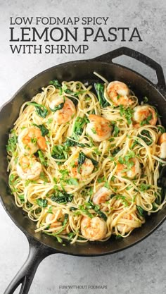 pasta with shrimp and spinach in a skillet