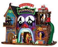 an inflatable house with clowns on the front and side walls, including a large mouth