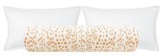 two pillows and a pillow case with an orange pattern on the front, one in white